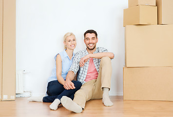 Image showing couple with cardboard boxes moving to new home