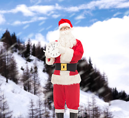 Image showing man in costume of santa claus with clock