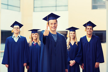 Image showing group of smiling students in mortarboards