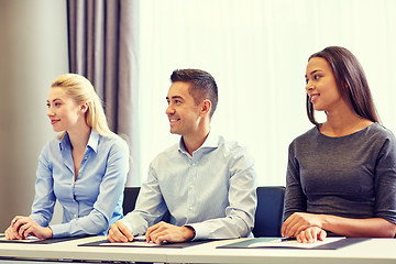 Image showing group of smiling businesspeople meeting in office