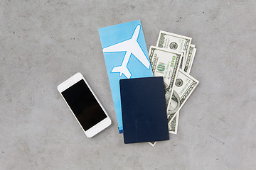 Image showing air ticket, money, smartphone and passport