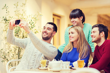 Image showing group of friends taking selfie with smartphone