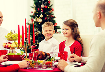 Image showing smiling family having holiday dinner at home