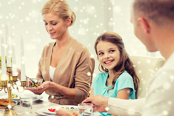 Image showing smiling family having holiday dinner at home