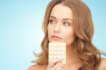 Image showing beautiful young woman with medication