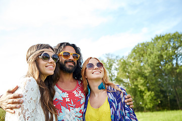 Image showing smiling young hippie friends outdoors