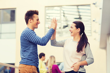 Image showing group of smiling students outdoors