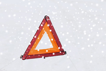 Image showing closeup of warning triangle on snow
