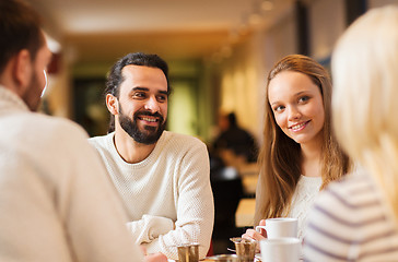 Image showing happy couple meeting and drinking tea or coffee