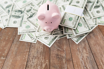 Image showing close up of dollar money and piggy bank on table