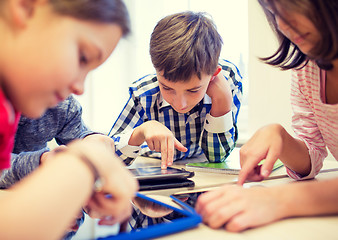 Image showing group of school kids with tablet pc in classroom