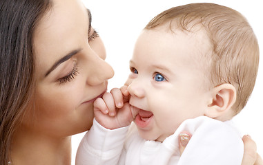 Image showing smiling baby in mother hands