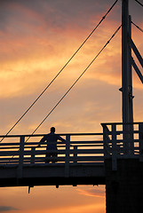 Image showing Man watching sunset