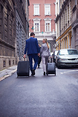 Image showing business people couple entering  hotel