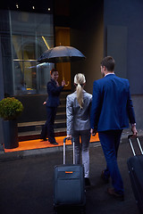 Image showing business people couple entering  hotel