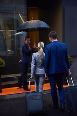 Image showing business people couple entering  hotel