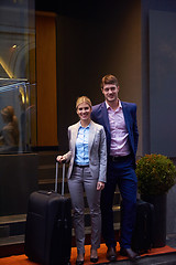 Image showing business people couple entering  hotel