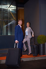 Image showing business people couple entering  hotel