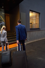 Image showing business people couple entering  hotel