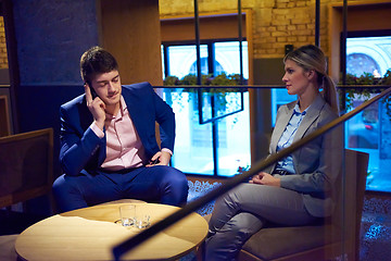 Image showing business couple take drink after work