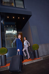 Image showing business people couple entering  hotel