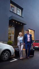 Image showing business people couple entering  hotel