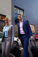 Image showing business people couple entering  hotel