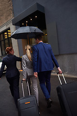 Image showing business people couple entering  hotel