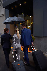 Image showing business people couple entering  hotel