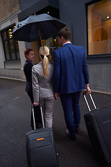 Image showing business people couple entering  hotel