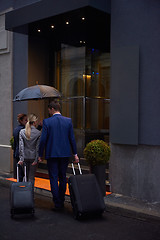 Image showing business people couple entering  hotel