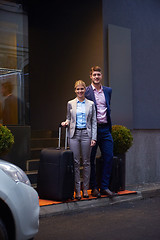 Image showing business people couple entering  hotel