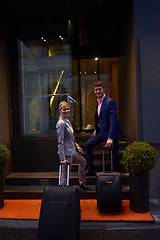 Image showing business people couple entering  hotel