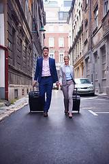 Image showing business people couple entering  hotel