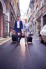 Image showing business people couple entering  hotel