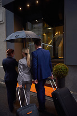 Image showing business people couple entering  hotel