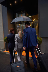 Image showing business people couple entering  hotel