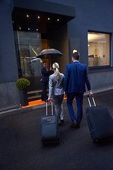 Image showing business people couple entering  hotel