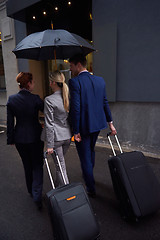 Image showing business people couple entering  hotel