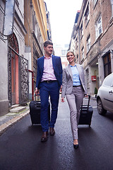 Image showing business people couple entering  hotel