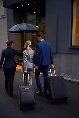 Image showing business people couple entering  hotel