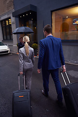 Image showing business people couple entering  hotel