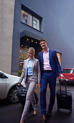 Image showing business people couple entering  hotel