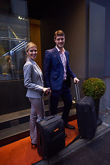 Image showing business people couple entering  hotel