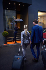 Image showing business people couple entering  hotel