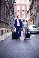 Image showing business people couple entering  hotel