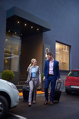 Image showing business people couple entering  hotel