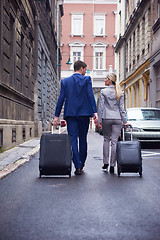 Image showing business people couple entering  hotel