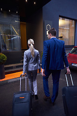 Image showing business people couple entering  hotel