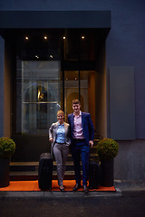 Image showing business people couple entering  hotel